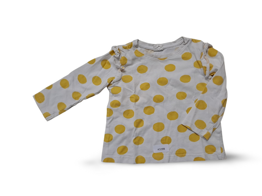 Long-sleeved white shirt with yellow polka dots and ruffles - size 74